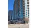 High-rise building with modern architecture, balconies, and a parking structure at the base at 361 17Th Nw St # 1021, Atlanta, GA 30363