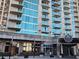 12 Midtown building exterior featuring modern architecture with glass windows and balcony views at 361 17Th Nw St # 1021, Atlanta, GA 30363