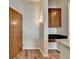 Hallway with a granite breakfast bar and dark wood cabinets at 361 17Th Nw St # 1021, Atlanta, GA 30363
