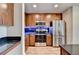 Modern kitchen with stainless steel appliances, dark cabinetry, and stylish countertops at 361 17Th Nw St # 1021, Atlanta, GA 30363