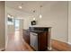 Kitchen with stainless steel appliances, dark wood cabinets, and hardwood floors at 361 17Th Nw St # 1021, Atlanta, GA 30363
