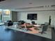 Modern and comfortable sitting area with sleek furniture, a large screen TV and accent wall at 361 17Th Nw St # 1021, Atlanta, GA 30363
