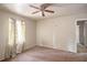 A small bedroom featuring a window and ceiling fan at 832 N Evelyn Pl, Atlanta, GA 30318