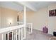 Upstairs landing with white railings and neutral color palette at 875 Edgewater Cir, Marietta, GA 30062