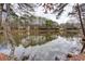 Stunning lake view surrounded by mature trees offering a peaceful retreat at 875 Edgewater Cir, Marietta, GA 30062