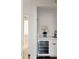 Elegant bar area features a wine cooler and white cabinetry at 3051 Habersham Nw Rd, Atlanta, GA 30305