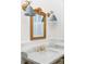 Bathroom vanity with marble countertop, gold fixtures, and ornate mirror at 3051 Habersham Nw Rd, Atlanta, GA 30305