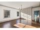 Bedroom with hardwood floors, chandelier, built-in storage, and large windows at 3051 Habersham Nw Rd, Atlanta, GA 30305