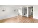 Bright bedroom featuring hardwood floors, sconces, and an ensuite bathroom at 3051 Habersham Nw Rd, Atlanta, GA 30305
