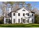 Elegant white brick home with symmetrical windows and a well-manicured lawn offers classic curb appeal at 3051 Habersham Nw Rd, Atlanta, GA 30305