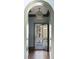 Hallway with an arched doorway and view to the exterior at 3051 Habersham Nw Rd, Atlanta, GA 30305