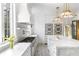 Bright kitchen with marble countertops, large island, and stainless steel appliances at 3051 Habersham Nw Rd, Atlanta, GA 30305