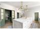 Spacious kitchen featuring a large island, custom cabinets, and stainless steel appliances at 3051 Habersham Nw Rd, Atlanta, GA 30305
