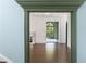 The living room, viewed through archway, has hardwood floors and a cozy fireplace at 3051 Habersham Nw Rd, Atlanta, GA 30305
