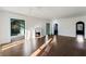 Spacious living room with hardwood floors, fireplace, and access to a sunroom offers comfortable living at 3051 Habersham Nw Rd, Atlanta, GA 30305