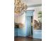 Living room features paneled walls, mural, hardwood floors, and a crystal chandelier at 3051 Habersham Nw Rd, Atlanta, GA 30305
