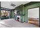 Charming sun room featuring a fireplace and views of the private backyard at 3051 Habersham Nw Rd, Atlanta, GA 30305