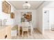 Bright dining room featuring white table and chairs, artistic decor, and a cozy ambiance at 3529 Essex Ave # 75, Atlanta, GA 30339