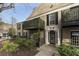 Traditional brick condo building with a balcony and trimmed bushes at 3529 Essex Ave # 75, Atlanta, GA 30339