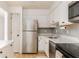 Bright kitchen showcases stainless steel appliances, white cabinetry, and a modern backsplash at 3529 Essex Ave # 75, Atlanta, GA 30339