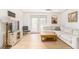 Cozy living room with light wood floors, a sectional sofa, and French doors leading to the outside at 3529 Essex Ave # 75, Atlanta, GA 30339