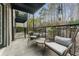 Relax on this outdoor patio with nature views and space for seating at 3529 Essex Ave # 75, Atlanta, GA 30339