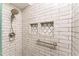This tiled shower is detailed with geometric-patterned storage niches at 3529 Essex Ave # 75, Atlanta, GA 30339