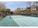 Community tennis court with fencing and net ready for play at 3529 Essex Ave # 75, Atlanta, GA 30339