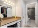 Bathroom vanity with stone countertop, sliding door closet and glass shower at 3655 Habersham Ne Rd # 226-A, Atlanta, GA 30305