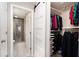 Walk-in closet with sliding door and custom shelving and a shower nearby at 3655 Habersham Ne Rd # 226-A, Atlanta, GA 30305
