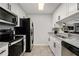 Modern kitchen with stainless steel appliances, white cabinets, and granite countertops at 3655 Habersham Ne Rd # 226-A, Atlanta, GA 30305