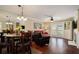 Open-concept living and dining areas with hardwood floors, fireplace, and a view to the backyard at 3655 Habersham Ne Rd # 226-A, Atlanta, GA 30305