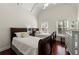 Bright bedroom with two beds, and a crib with hardwood floors at 730 Glenferry Trl, Atlanta, GA 30328