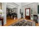 Inviting foyer with hardwood floors, rug, and a decorative front door with sidelights at 730 Glenferry Trl, Atlanta, GA 30328