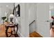 Foyer features hardwood floors, a decorative table, and staircase, creating an inviting entrance at 730 Glenferry Trl, Atlanta, GA 30328