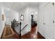 Well-lit hallway with hardwood floors, leading to walk-in closet and other rooms at 730 Glenferry Trl, Atlanta, GA 30328