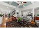 Spacious living room features hardwood floors, coffered ceilings, and an open floor plan connecting to the kitchen and dining area at 730 Glenferry Trl, Atlanta, GA 30328