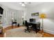 Cozy home office with natural light, plantation shutters, and classic wooden floors at 730 Glenferry Trl, Atlanta, GA 30328