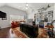 Office with built-in shelves, hardwood floors, and bright natural light at 730 Glenferry Trl, Atlanta, GA 30328