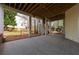 Covered patio area providing ample space for outdoor entertaining, featuring a concrete floor and backyard access at 730 Glenferry Trl, Atlanta, GA 30328