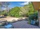 Private backyard featuring a cozy wooden deck and lush greenery at 1115 Riverbend Club Se Dr, Atlanta, GA 30339