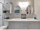 Bathroom with double vanity, modern fixtures, and a gray color palette at 1115 Riverbend Club Se Dr, Atlanta, GA 30339
