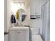 White bathroom with a shower/tub combination, stylish vanity, and modern fixtures at 1115 Riverbend Club Se Dr, Atlanta, GA 30339
