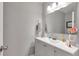 Well-lit bathroom with a modern vanity, a sleek mirror, and neutral decor at 1115 Riverbend Club Se Dr, Atlanta, GA 30339