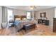 Comfortable bedroom with a ceiling fan, natural light, and wood laminate floors at 1115 Riverbend Club Se Dr, Atlanta, GA 30339