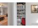 Well-organized linen closet with shelving and storage at 1115 Riverbend Club Se Dr, Atlanta, GA 30339