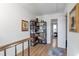 Upstairs hallway with a charming bookshelf and view into a bedroom at 1115 Riverbend Club Se Dr, Atlanta, GA 30339