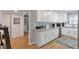 Bright and spacious kitchen featuring white cabinets, modern appliances, and ample counter space at 1115 Riverbend Club Se Dr, Atlanta, GA 30339