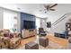 Stylish living room with hardwood floors, modern lighting, and easy access to the entryway at 1115 Riverbend Club Se Dr, Atlanta, GA 30339