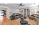 Cozy living room with hardwood floors, a ceiling fan, and a comfortable seating area at 1115 Riverbend Club Se Dr, Atlanta, GA 30339